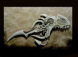 A detailed stone carving of a creature's head and sharp weapon.